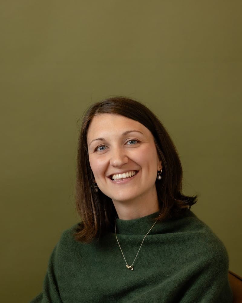 Marni in a green jumper, laughing